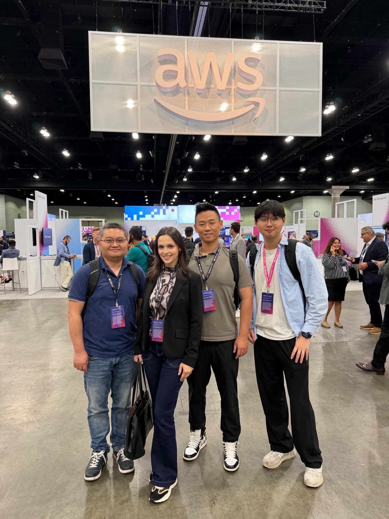 The Patriot Conceptions team beneath the AWS sign at AWS Summit Los Angeles.